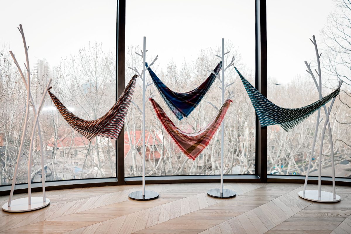 Floating scarves were planned as a signature moment and an emotional anchor for this pop-up display design; Image Source: Melchers China